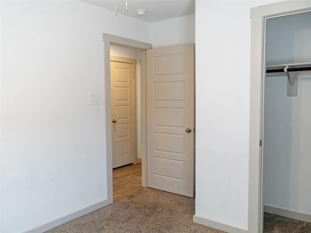711 Boer Plains Dr, Rosharon, TX 77583 - unfurnished bedroom featuring light carpet, a closet, and baseboards