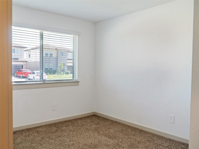 711 Boer Plains Dr, Rosharon, TX 77583 - empty room featuring light carpet and baseboards