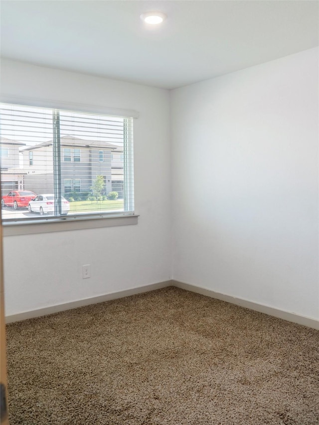 711 Boer Plains Dr, Rosharon, TX 77583 - carpeted spare room with baseboards