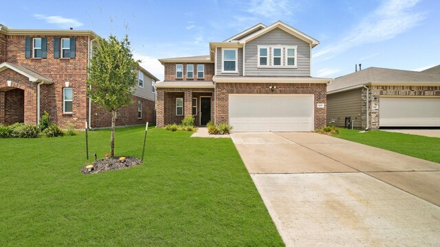 6630 Elks Trce, Richmond, TX 77406 - view of front of property featuring an attached garage, a front yard, driveway, and brick siding
