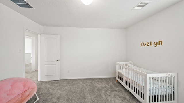 6630 Elks Trce, Richmond, TX 77406 - carpeted bedroom featuring visible vents, baseboards, and a crib