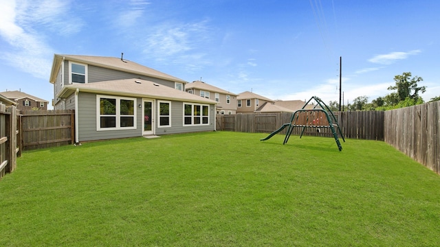 6630 Elks Trce, Richmond, TX 77406 - view of yard with a fenced backyard and a playground