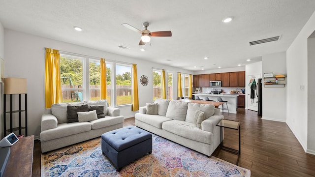 6630 Elks Trce, Richmond, TX 77406 - living room featuring visible vents, baseboards, recessed lighting, a ceiling fan, and dark wood finished floors