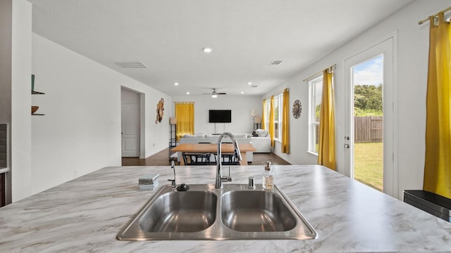 6630 Elks Trce, Richmond, TX 77406 - kitchen featuring visible vents, a ceiling fan, open floor plan, recessed lighting, and a sink