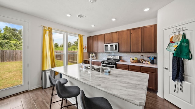 6630 Elks Trce, Richmond, TX 77406 - kitchen with visible vents, a sink, appliances with stainless steel finishes, and a healthy amount of sunlight