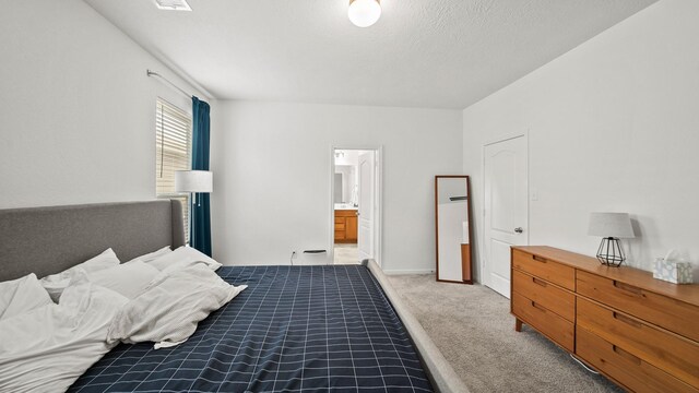 6630 Elks Trce, Richmond, TX 77406 - bedroom with light colored carpet and ensuite bath
