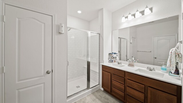 6630 Elks Trce, Richmond, TX 77406 - bathroom with double vanity, a sink, and a shower stall