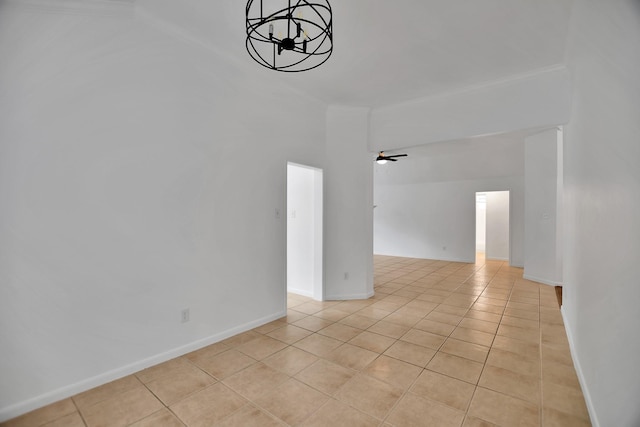 67 N Winterport Cir, The Woodlands, TX 77382 - spare room with light tile patterned floors, a chandelier, a ceiling fan, and baseboards
