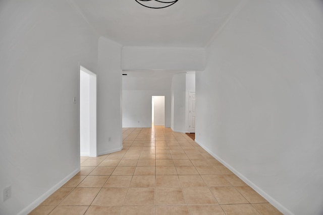 67 N Winterport Cir, The Woodlands, TX 77382 - hall featuring light tile patterned floors, crown molding, and baseboards