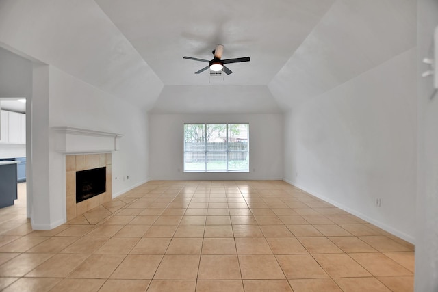 67 N Winterport Cir, The Woodlands, TX 77382 - unfurnished living room featuring ceiling fan, light tile patterned floors, a fireplace, lofted ceiling, and baseboards