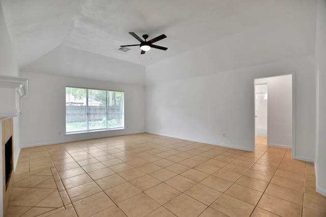 67 N Winterport Cir, The Woodlands, TX 77382 - unfurnished living room featuring light tile patterned flooring, a ceiling fan, lofted ceiling, a fireplace, and baseboards