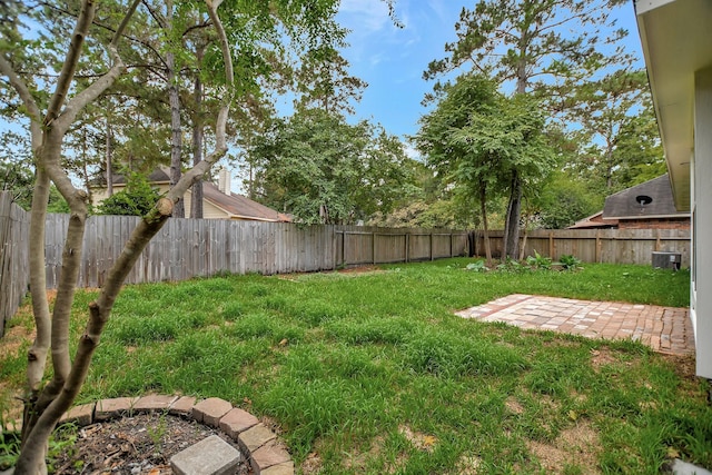 67 N Winterport Cir, The Woodlands, TX 77382 - view of yard featuring cooling unit and a patio area