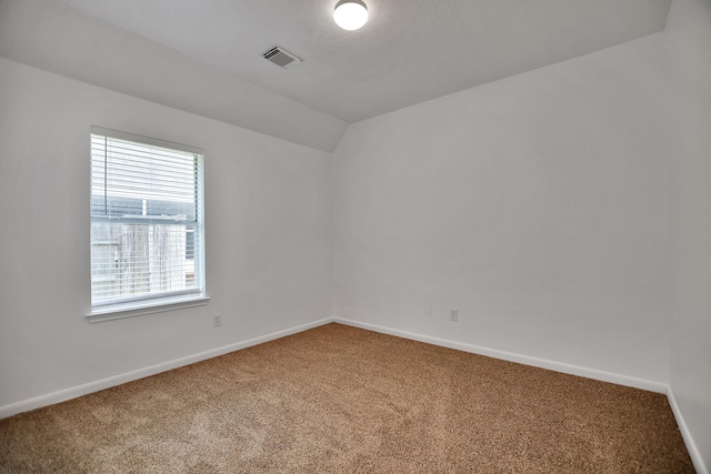 67 N Winterport Cir, The Woodlands, TX 77382 - carpeted spare room with baseboards and vaulted ceiling