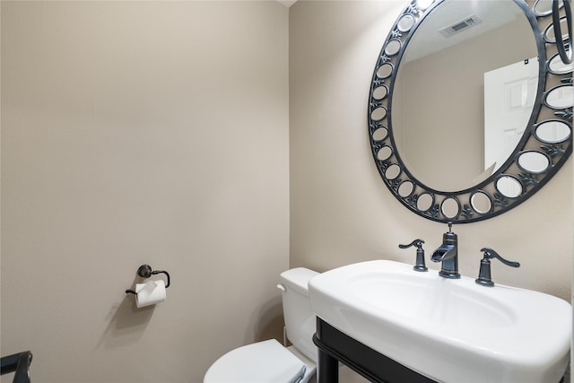 23106 Willow Canyon Dr, Katy, TX 77494 - half bath featuring a sink and toilet