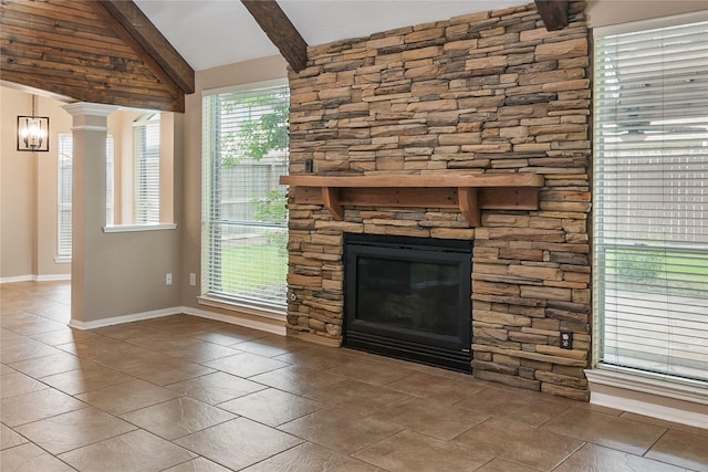 23106 Willow Canyon Dr, Katy, TX 77494 - unfurnished living room with a fireplace, tile patterned flooring, and baseboards