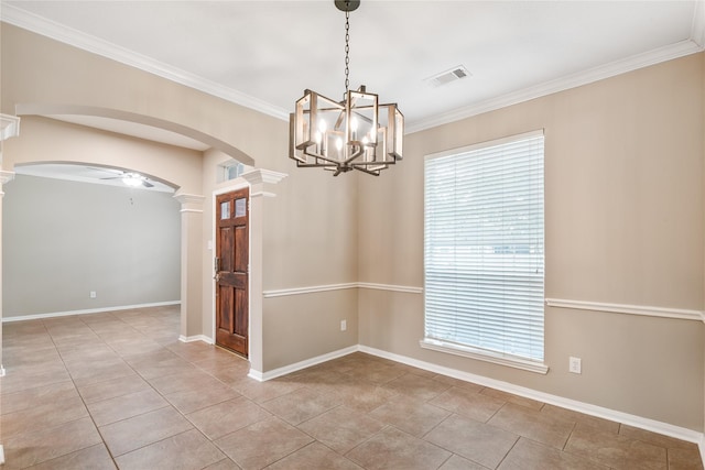 23106 Willow Canyon Dr, Katy, TX 77494 - empty room with arched walkways, ornate columns, a chandelier, crown molding, and plenty of natural light