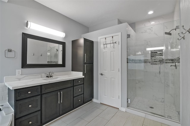 23106 Willow Canyon Dr, Katy, TX 77494 - full bath featuring a marble finish shower, vanity, and baseboards