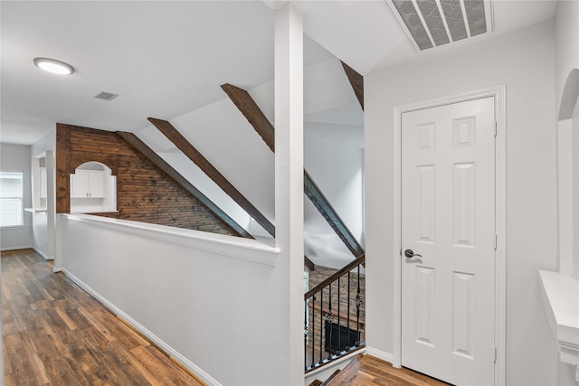23106 Willow Canyon Dr, Katy, TX 77494 - hallway with wood finished floors, vaulted ceiling, baseboards, and stairs