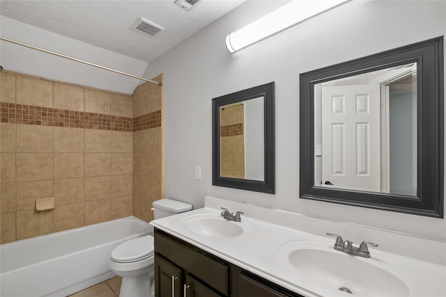 23106 Willow Canyon Dr, Katy, TX 77494 - bathroom with toilet, double vanity, shower / tub combination, tile patterned floors, and a textured ceiling