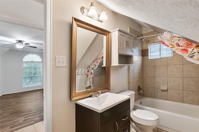 23106 Willow Canyon Dr, Katy, TX 77494 - full bathroom featuring a textured ceiling, toilet, vanity, ceiling fan, and shower / bath combination