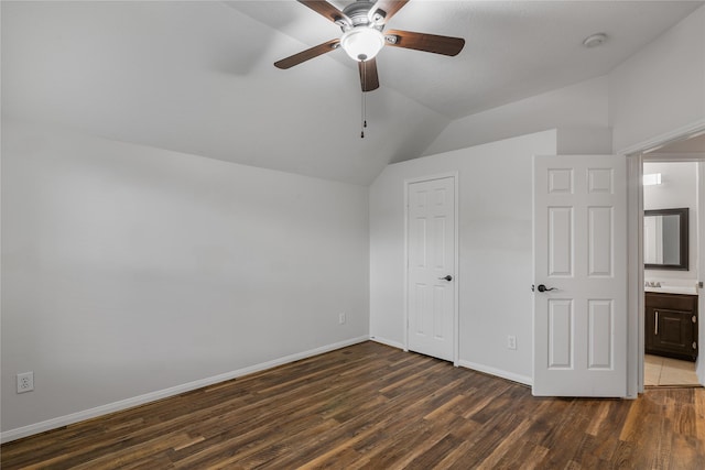 23106 Willow Canyon Dr, Katy, TX 77494 - unfurnished bedroom with lofted ceiling, dark wood-style flooring, baseboards, ceiling fan, and a closet