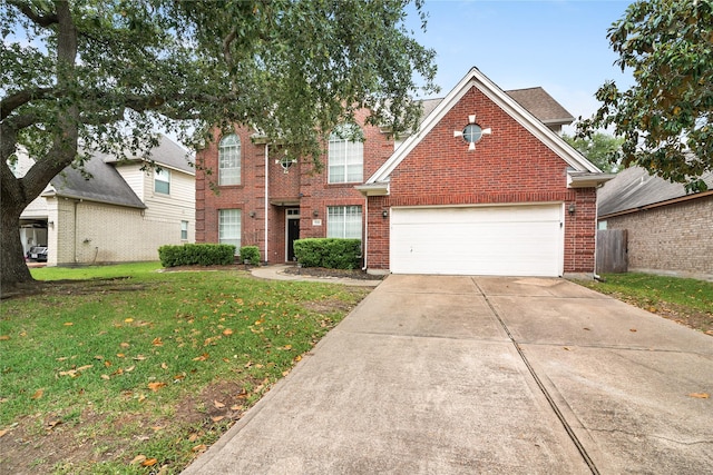 23106 Willow Canyon Dr, Katy, TX 77494 - traditional-style house featuring driveway, a front lawn, and brick siding