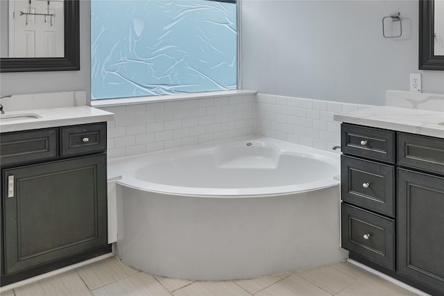 23106 Willow Canyon Dr, Katy, TX 77494 - bathroom featuring a garden tub and two vanities