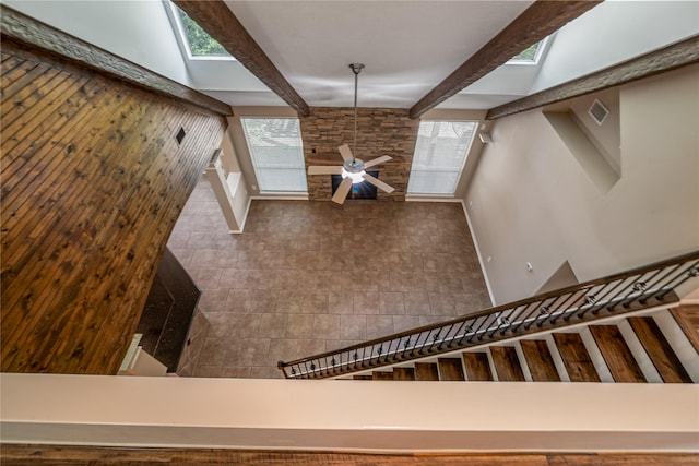 23106 Willow Canyon Dr, Katy, TX 77494 - stairway with beam ceiling, a skylight, and a ceiling fan