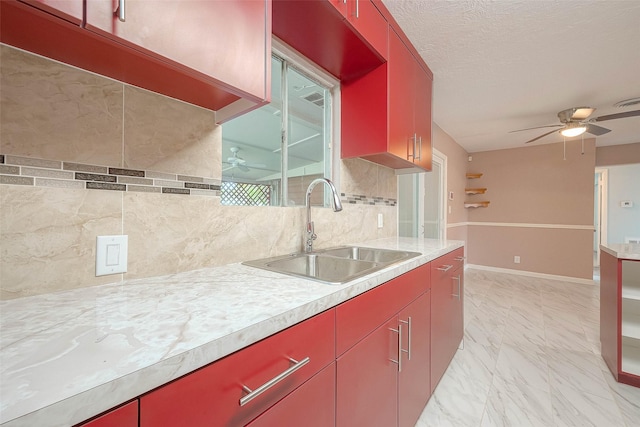 7022 Triola Ln, Houston, TX 77074 - kitchen with red cabinetry, a sink, and ceiling fan