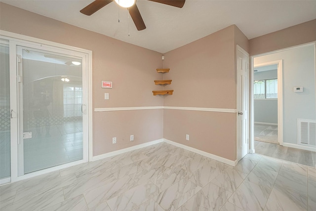 7022 Triola Ln, Houston, TX 77074 - unfurnished room with ceiling fan, visible vents, baseboards, and marble finish floor