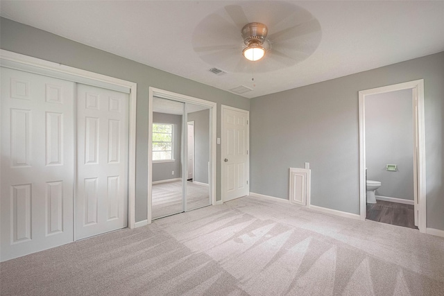 7022 Triola Ln, Houston, TX 77074 - unfurnished bedroom featuring visible vents, baseboards, carpet floors, multiple closets, and ensuite bath