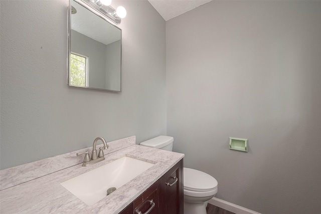 7022 Triola Ln, Houston, TX 77074 - half bath with toilet, baseboards, and vanity