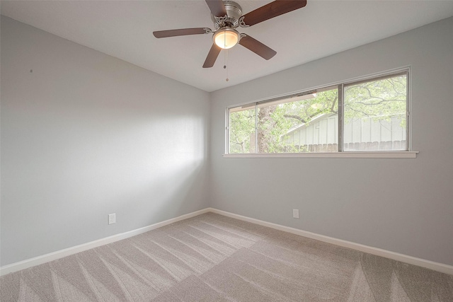 7022 Triola Ln, Houston, TX 77074 - empty room featuring baseboards, ceiling fan, and light carpet
