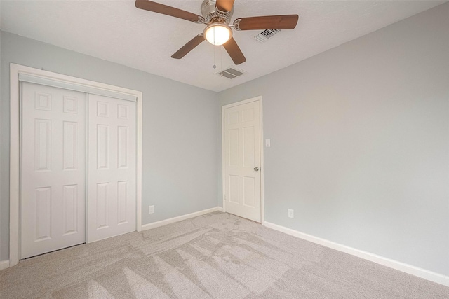7022 Triola Ln, Houston, TX 77074 - unfurnished bedroom with light colored carpet, baseboards, visible vents, and a closet