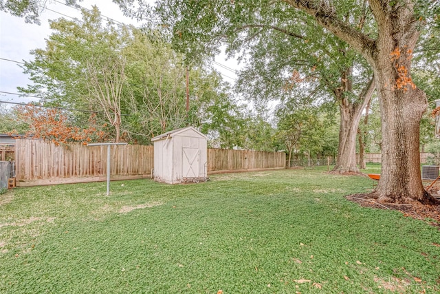 7022 Triola Ln, Houston, TX 77074 - view of yard featuring an outdoor structure, a fenced backyard, and a shed