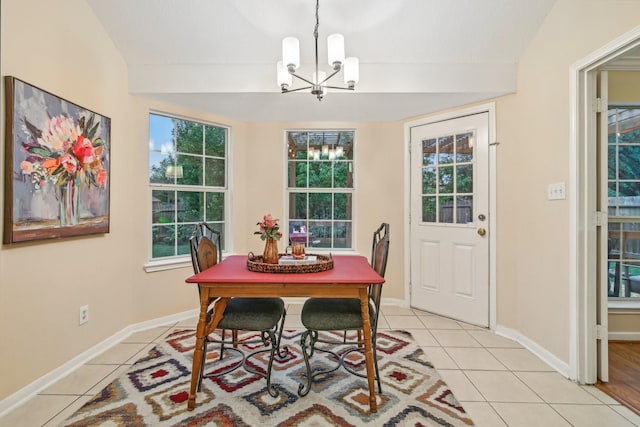 dining area with baseboards, a chandelier, and light tile patterned floors