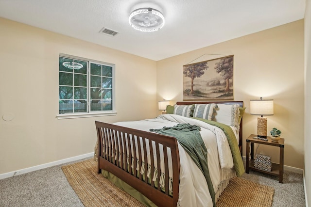 bedroom featuring carpet floors, baseboards, and visible vents