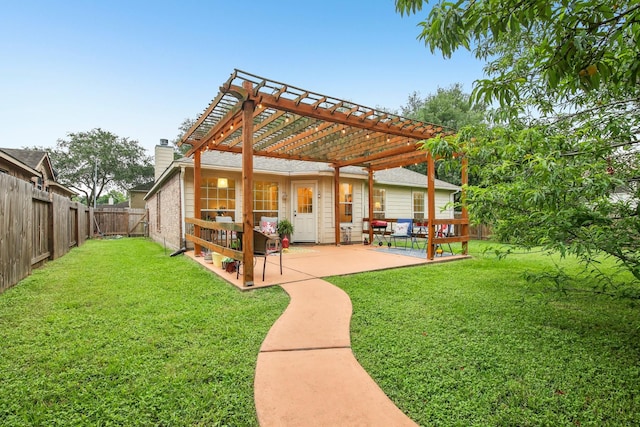 rear view of property featuring a patio, a fenced backyard, a yard, and a pergola