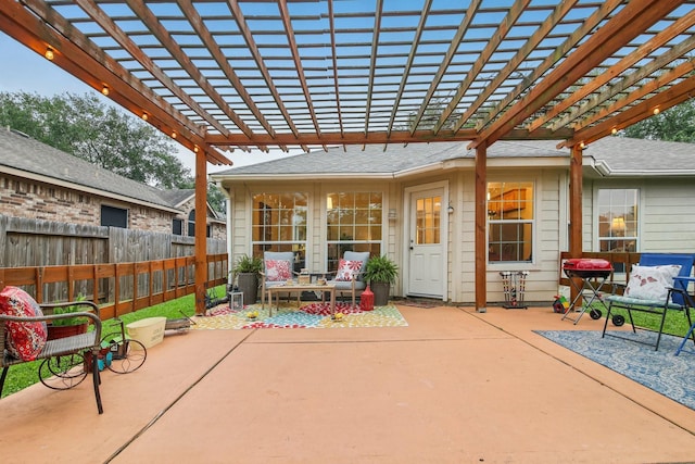 view of patio featuring fence and a pergola