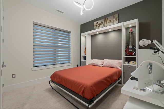 bedroom with carpet floors, baseboards, and visible vents