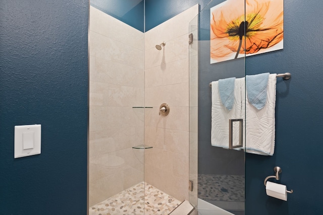 full bath with a tile shower