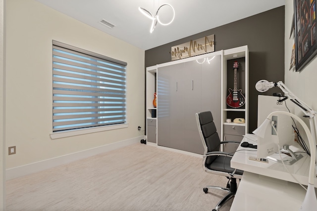 office space with visible vents, baseboards, and wood finished floors