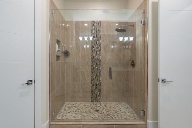 bathroom featuring a shower stall