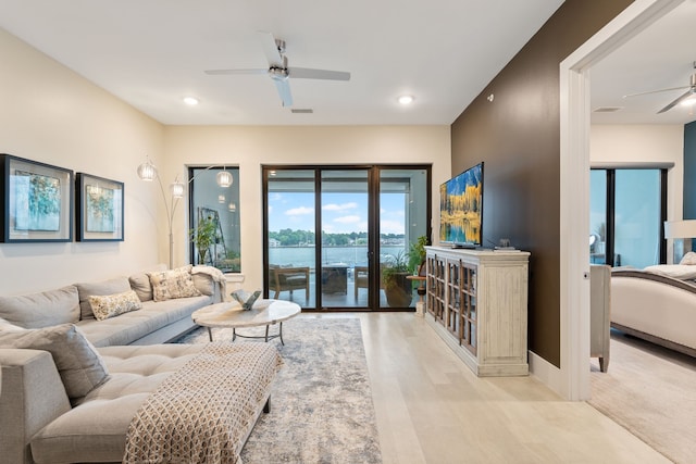 living area with visible vents, a ceiling fan, wood finished floors, and recessed lighting