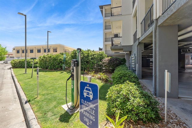 view of home's community featuring a lawn