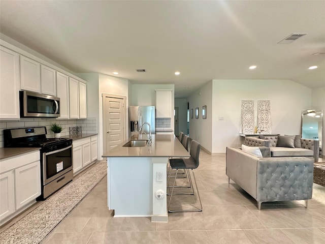 29403 Paytons Park Ct, Katy, TX 77494 - kitchen featuring stainless steel appliances, a sink, decorative backsplash, open floor plan, and recessed lighting