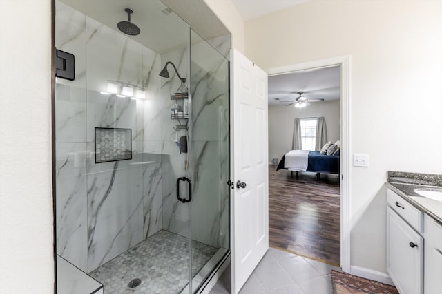 50 Canary St, Point Blank, TX 77364 - full bath featuring a marble finish shower, connected bathroom, vanity, a ceiling fan, and tile patterned floors