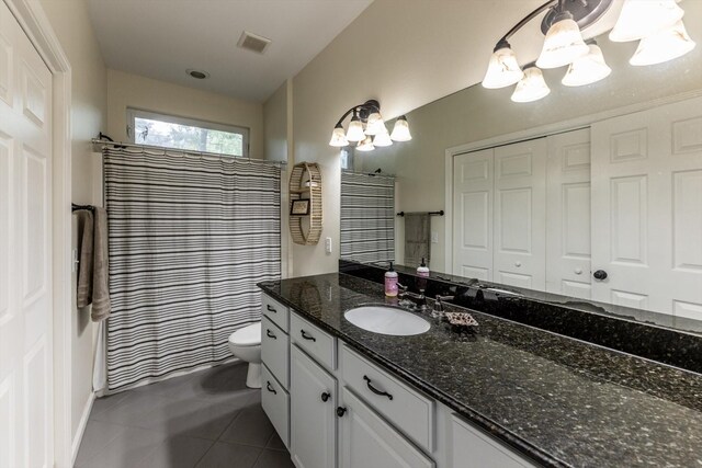 50 Canary St, Point Blank, TX 77364 - full bathroom featuring vanity, toilet, a chandelier, tile patterned floors, and a shower with shower curtain