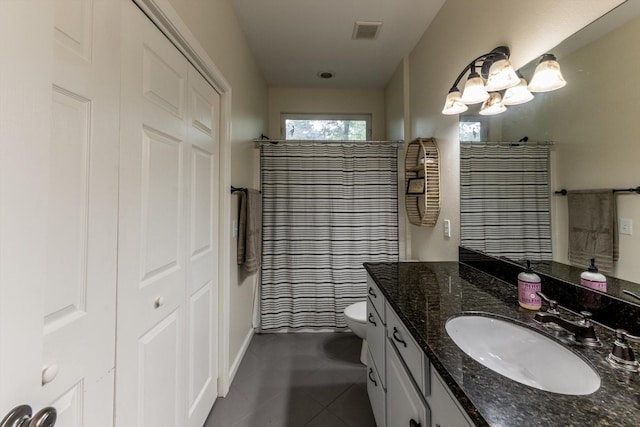 50 Canary St, Point Blank, TX 77364 - full bath with vanity, curtained shower, tile patterned flooring, toilet, and baseboards