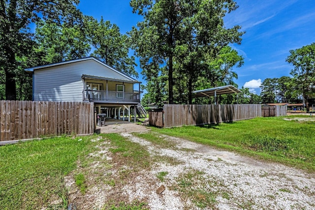 50 Canary St, Point Blank, TX 77364 - view of front of property featuring driveway, stairway, a porch, and a carport